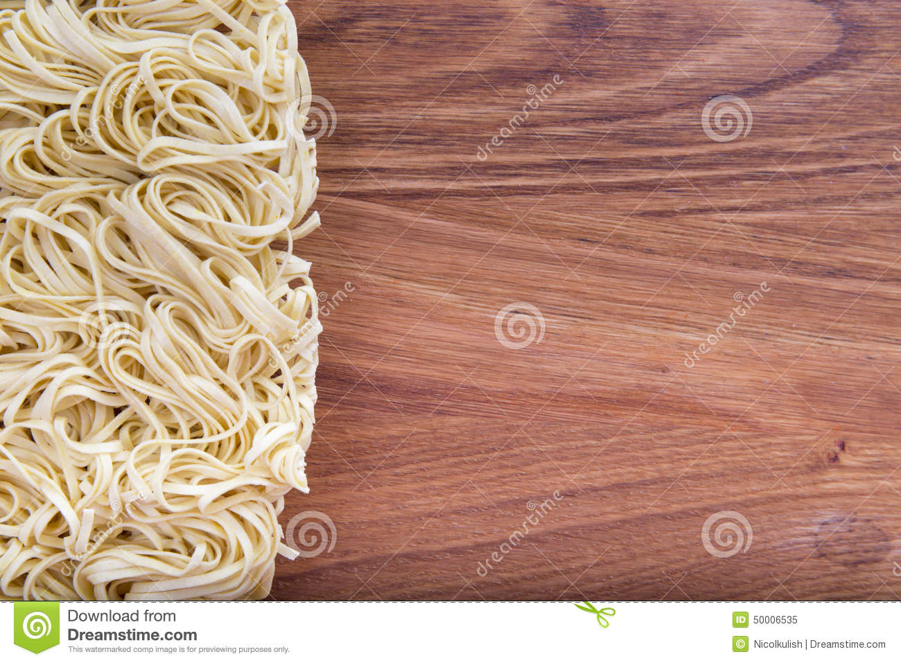 Egg Noodles Spiral Closeup On Wooden Background 