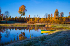 Sunrise In Autumn With A Boat Royalty Free Stock Photos