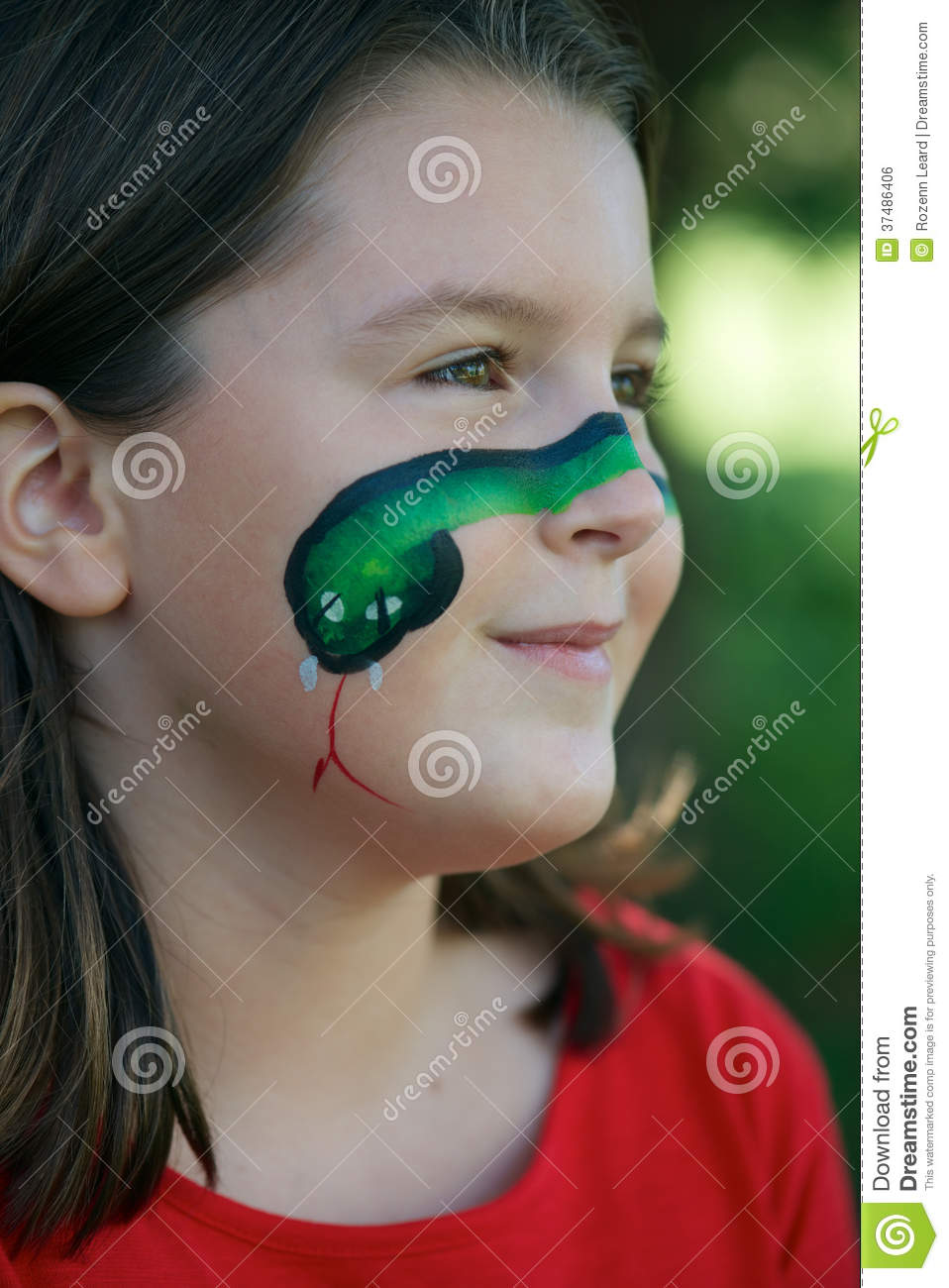 Young Girl With Green Snake Face Painting On Her Cheek