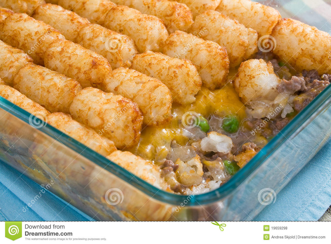 Casserole Made Of Tater Tots Cheddar Cheese Ground Beef Peas And