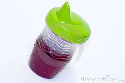 Child S Sippy Cup With Juice Royalty Free Stock Photography   Image