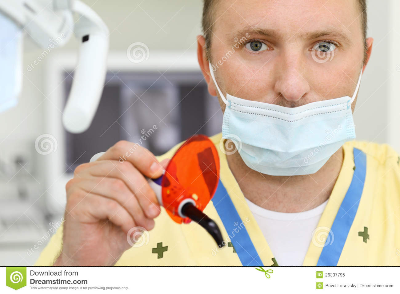 Dentist In Mask With Ultraviolet Curing Light Tool Royalty Free Stock