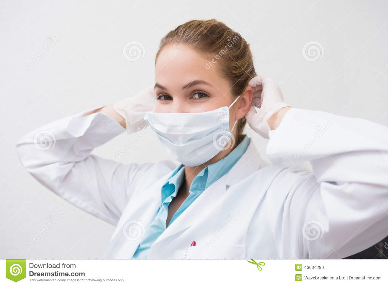 Dentist Putting On Her Surgical Mask Stock Photo   Image  43634290