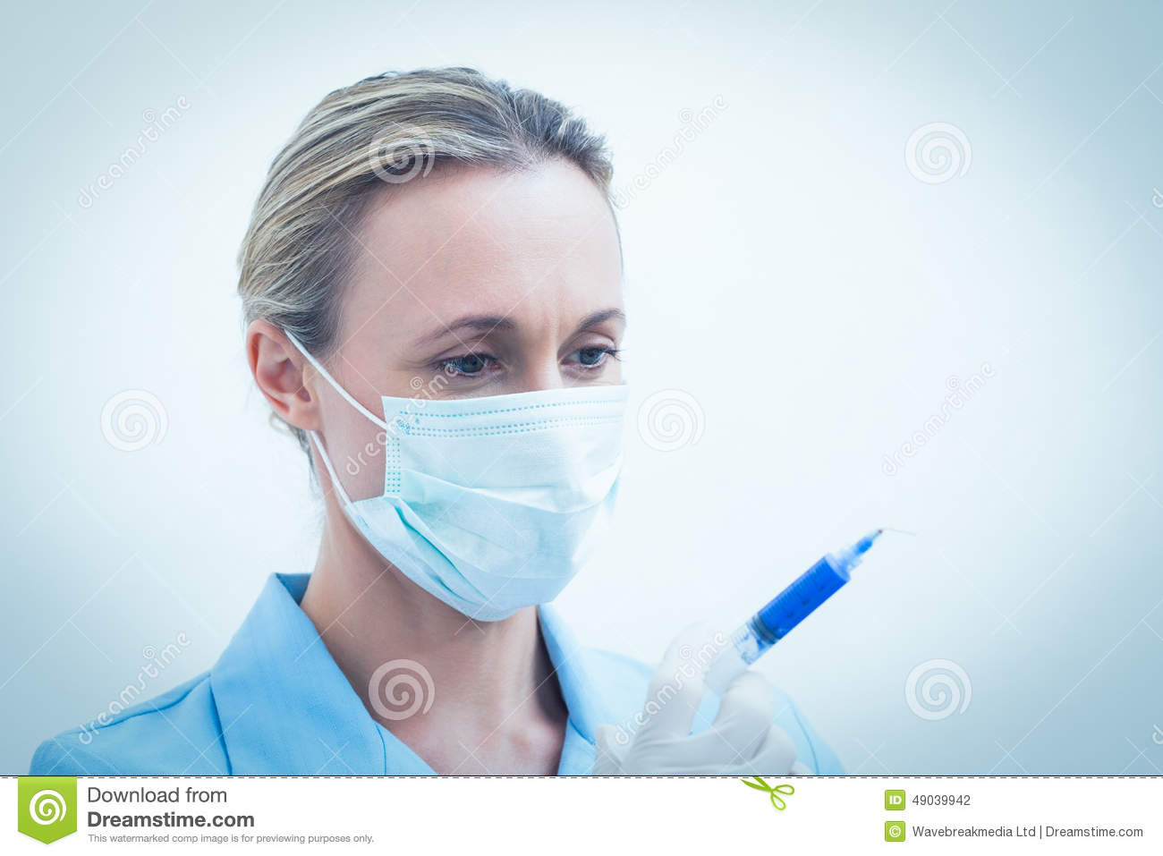Female Dentist In Surgical Mask Holding Injection Stock Photo   Image