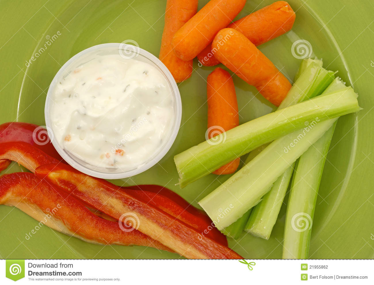     Red Pepper Baby Carrots Celery And Ranch Dressing On A Green Plate