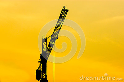 Silhouette Crane Working At Consturction Site Dawn Sky
