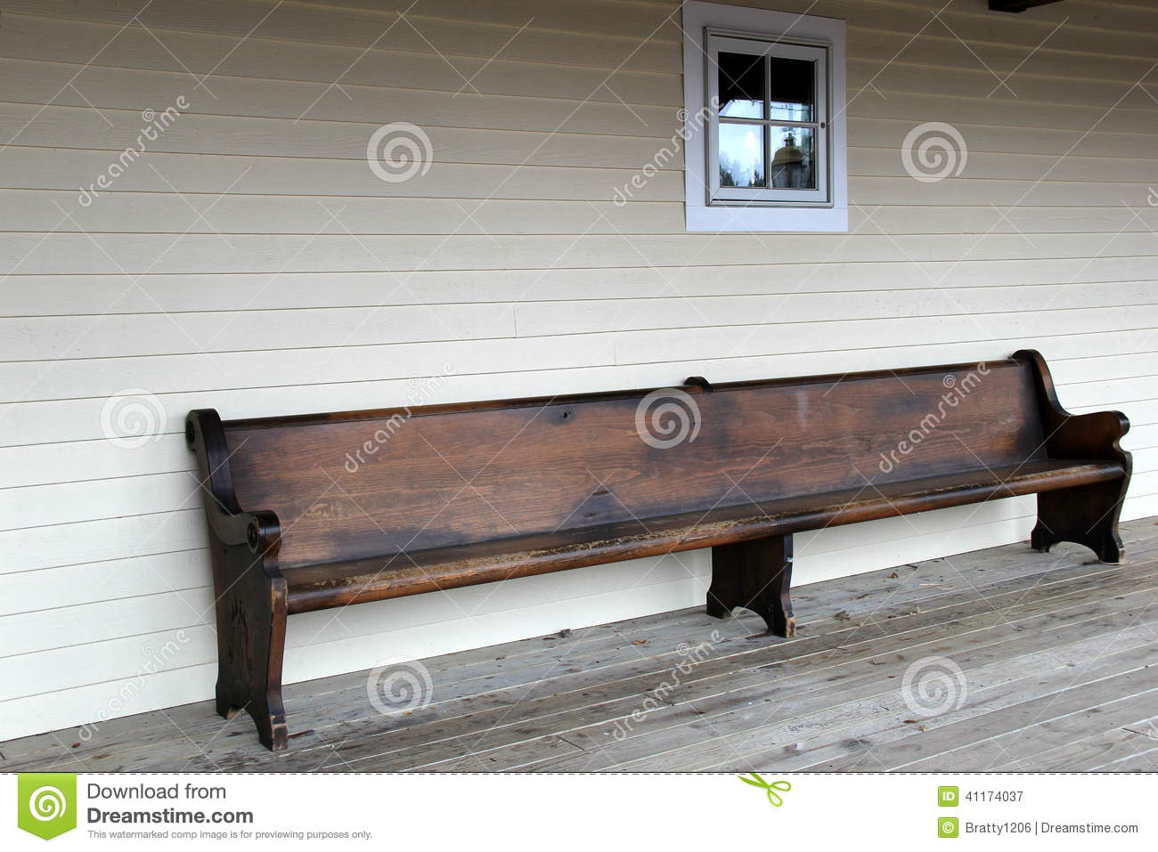 Old Bench Invites People To Come And Sit For Awhile On Country Porch