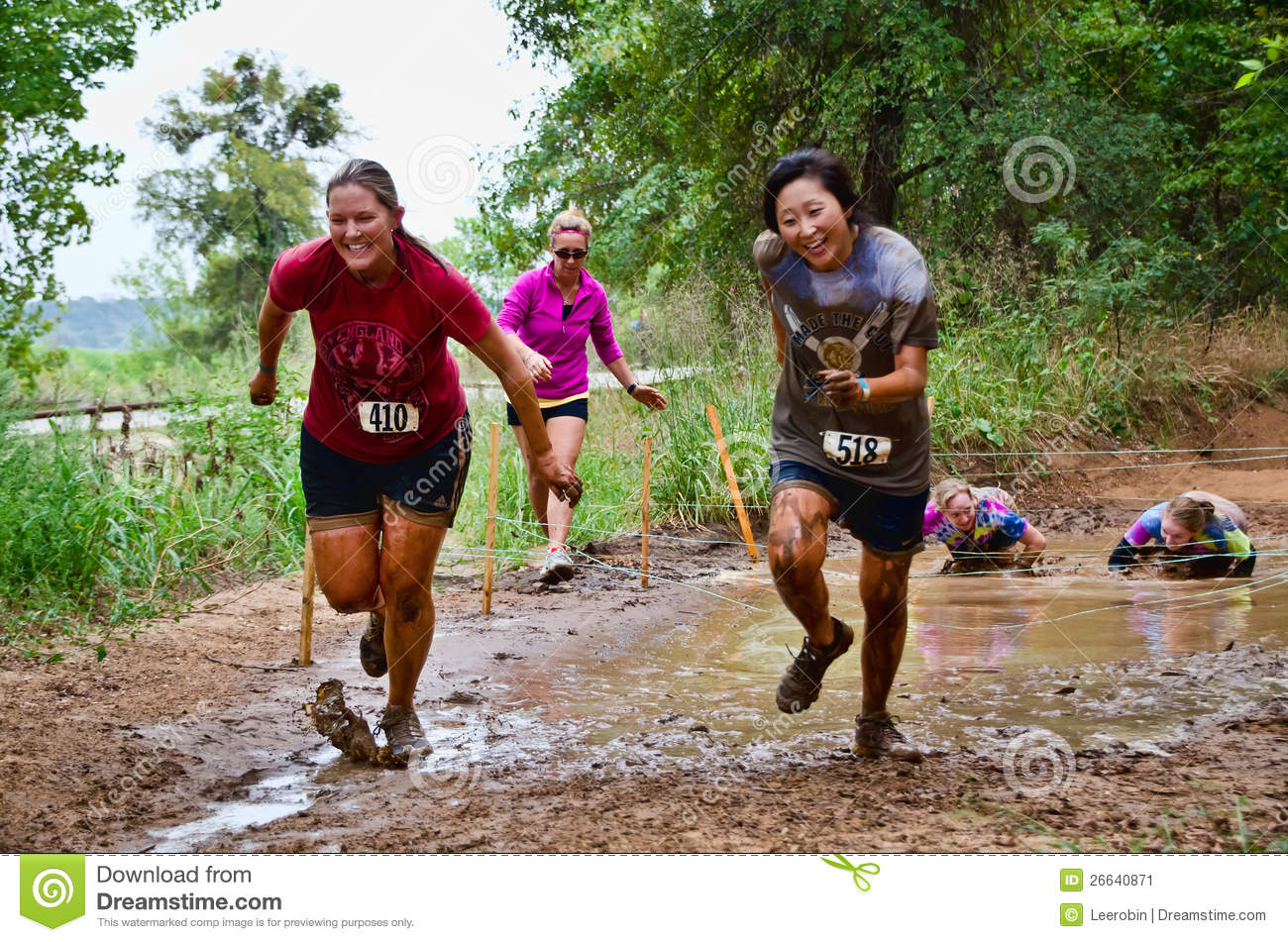 Mud Race Participants Passing Through A Mud Pit  Dash Of The Titans