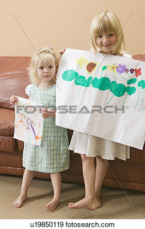 Stock Photograph Of 3 And 5 Year Old Girls Showing Off Their Artwork    