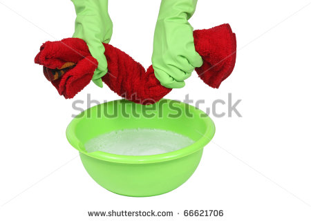 Rubber Gloved Hands Squeezing Wet Deep Red Towel Over Green Basin With    