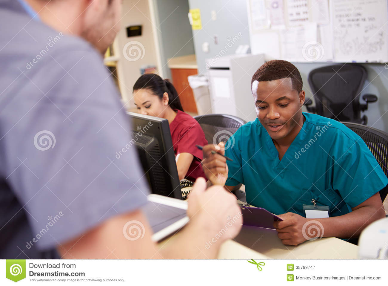 Medical Staff Meeting At Nurses Station Royalty Free Stock Photography