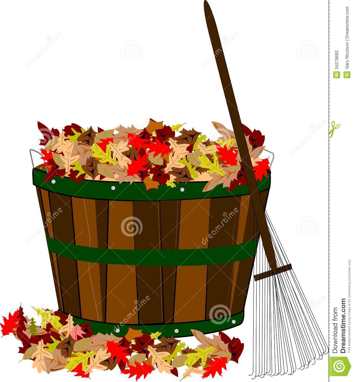 Pile Of Leaves In Wooden Basket With Wire Rake