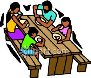 Family Eating At A Picnic Table   Royalty Free Clipart Picture