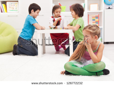 Little Girl Sitting Lonely   Feeling Excluded By The Others   Stock