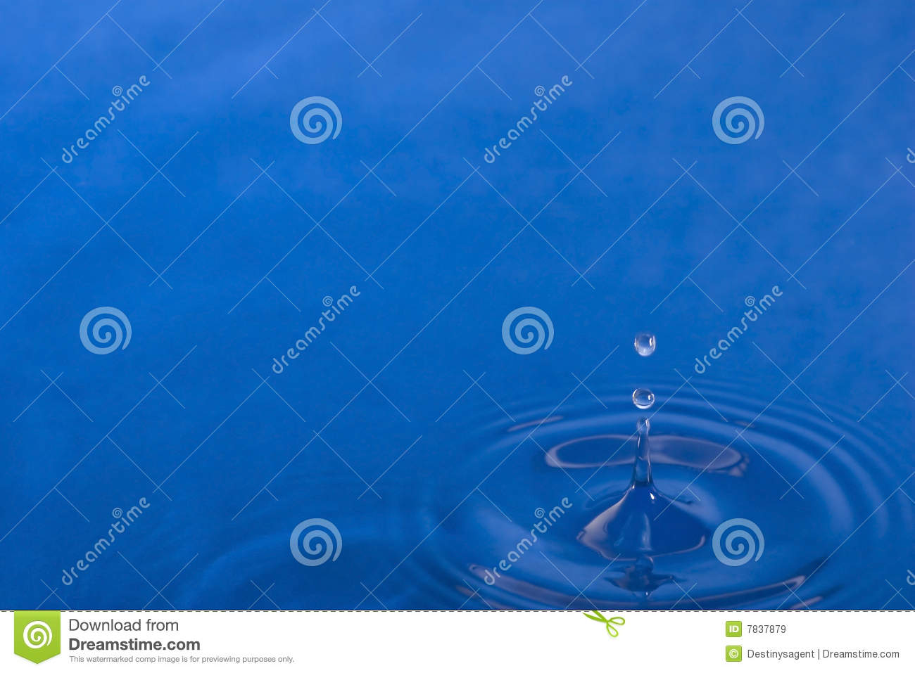 Drip Of Water And The Resulting Splash In A Pool Of Blue With Copy    