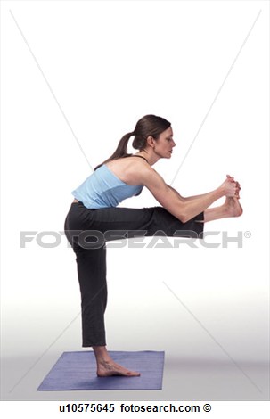 Stock Image   Woman Doing Standing Yoga Pose On Blue Mat  Fotosearch