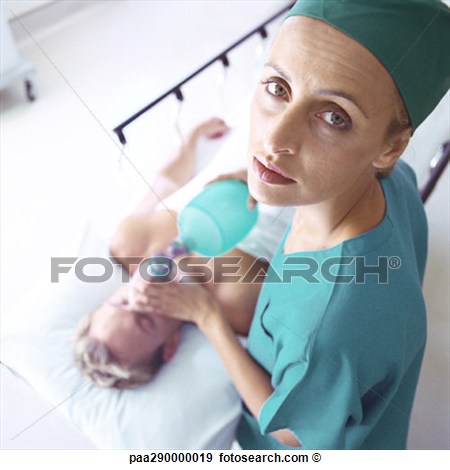 Female Doctor Holding Oxygen Mask Over Patient S Face High Angle View    