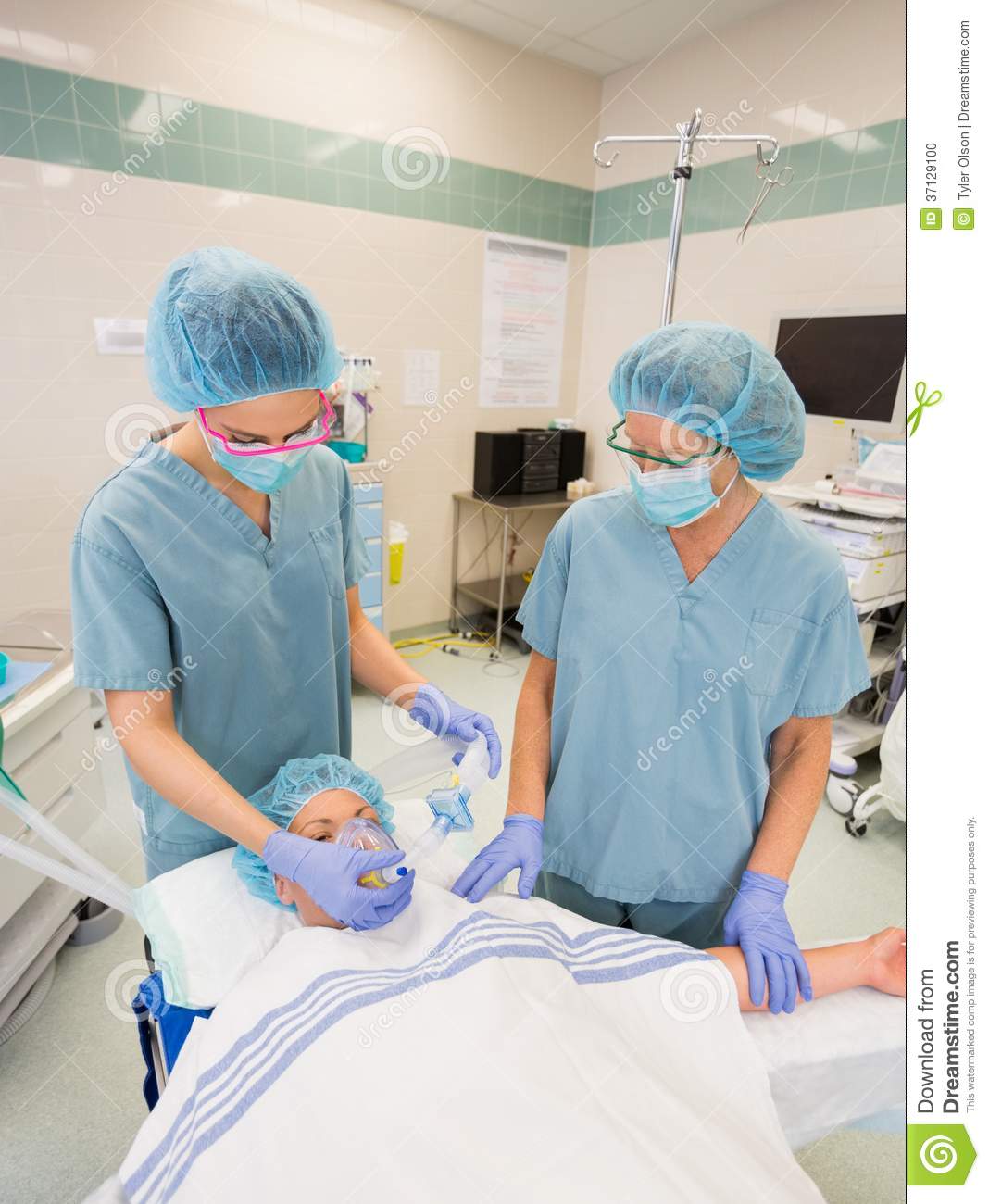 Nurses Adjusting Oxygen Mask On Female Patient Stock Photo   Image    