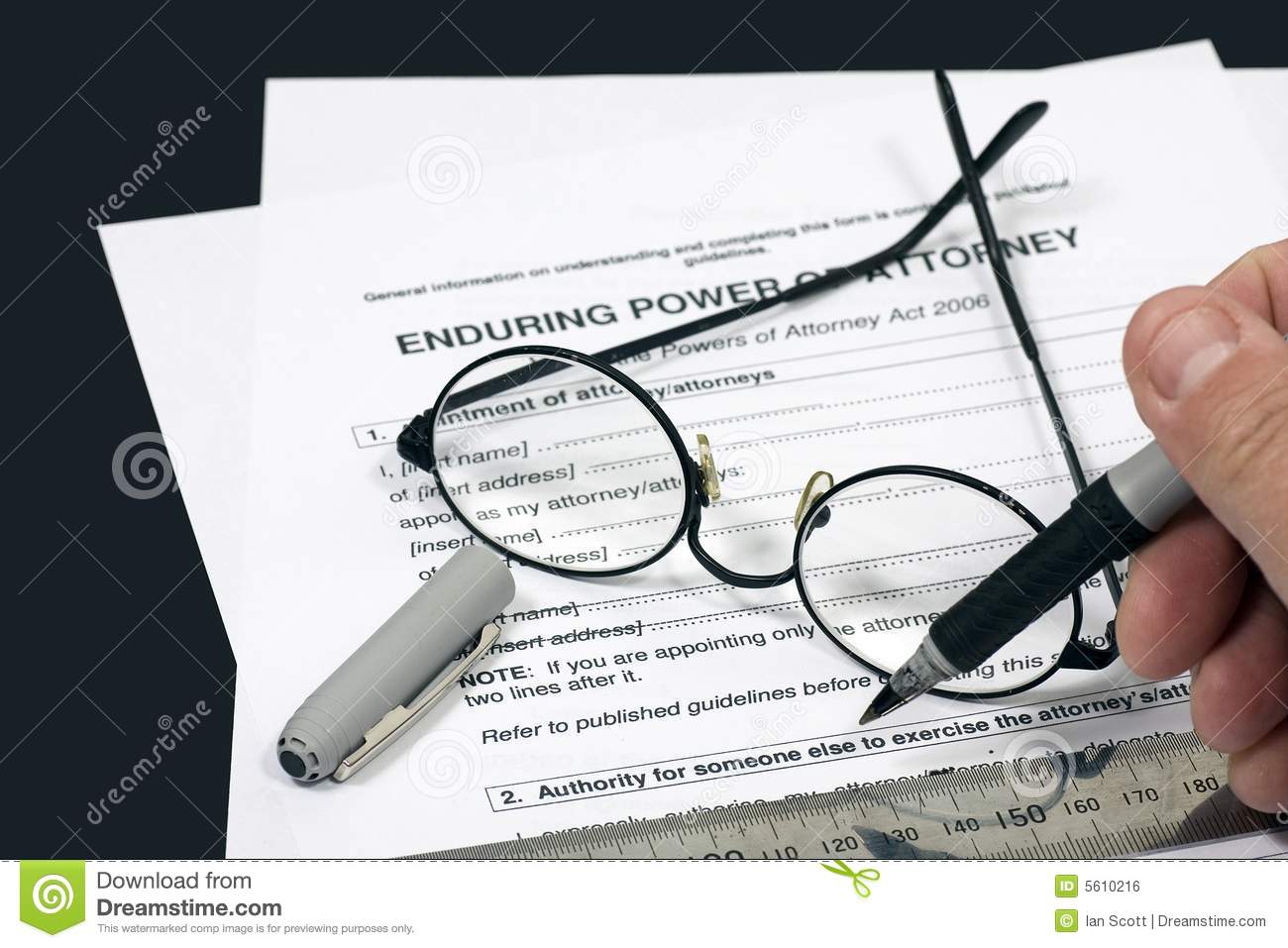 Close Up Of Power Of Attorney Contract With Reading Glasses And Pen