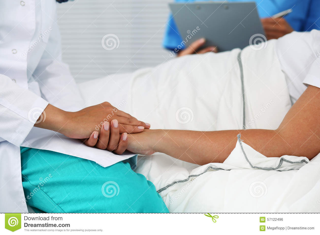 Friendly Female Doctor Hands Holding Patient Hand Lying In Bed For    