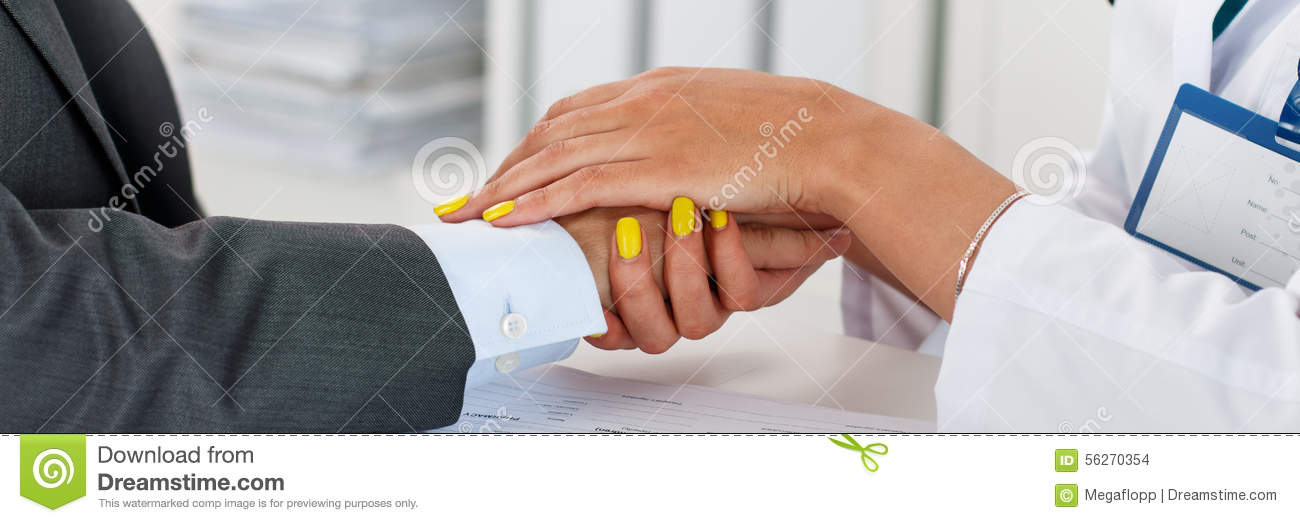 Friendly Female Doctor S Hands Holding Male Patient S Hand For    