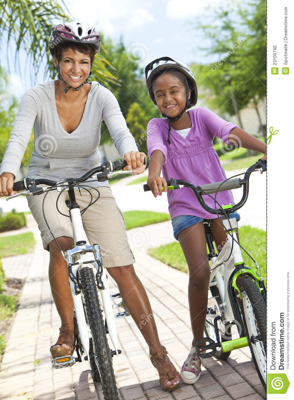 Happy African American Women And Child Mother   Daughter Cycling