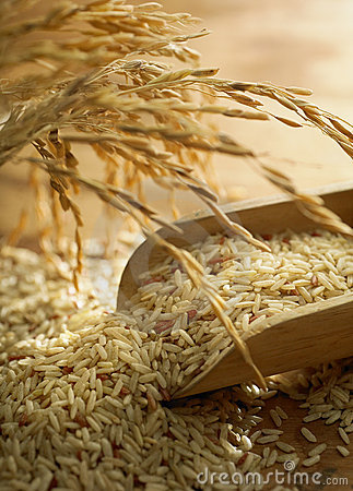 Mood Shot Of Rice Grain On Wooden Table 