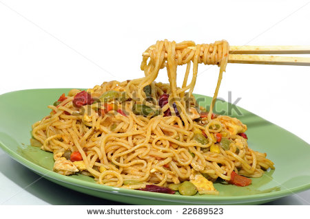Eating Spicy Chinese Noodles With A Pair Of Chopsticks   Stock Photo
