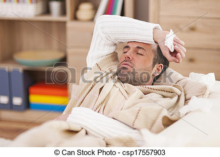 Stock Photo   Sick Man Lying Down On Couch With High Fever   Stock
