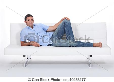 Stock Photo   Sulky Man Lying On A Couch   Stock Image Images