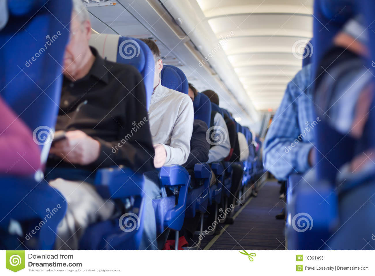 Aisle Between Seats In Airplane Cabin Shallow Depth Of Focus  People