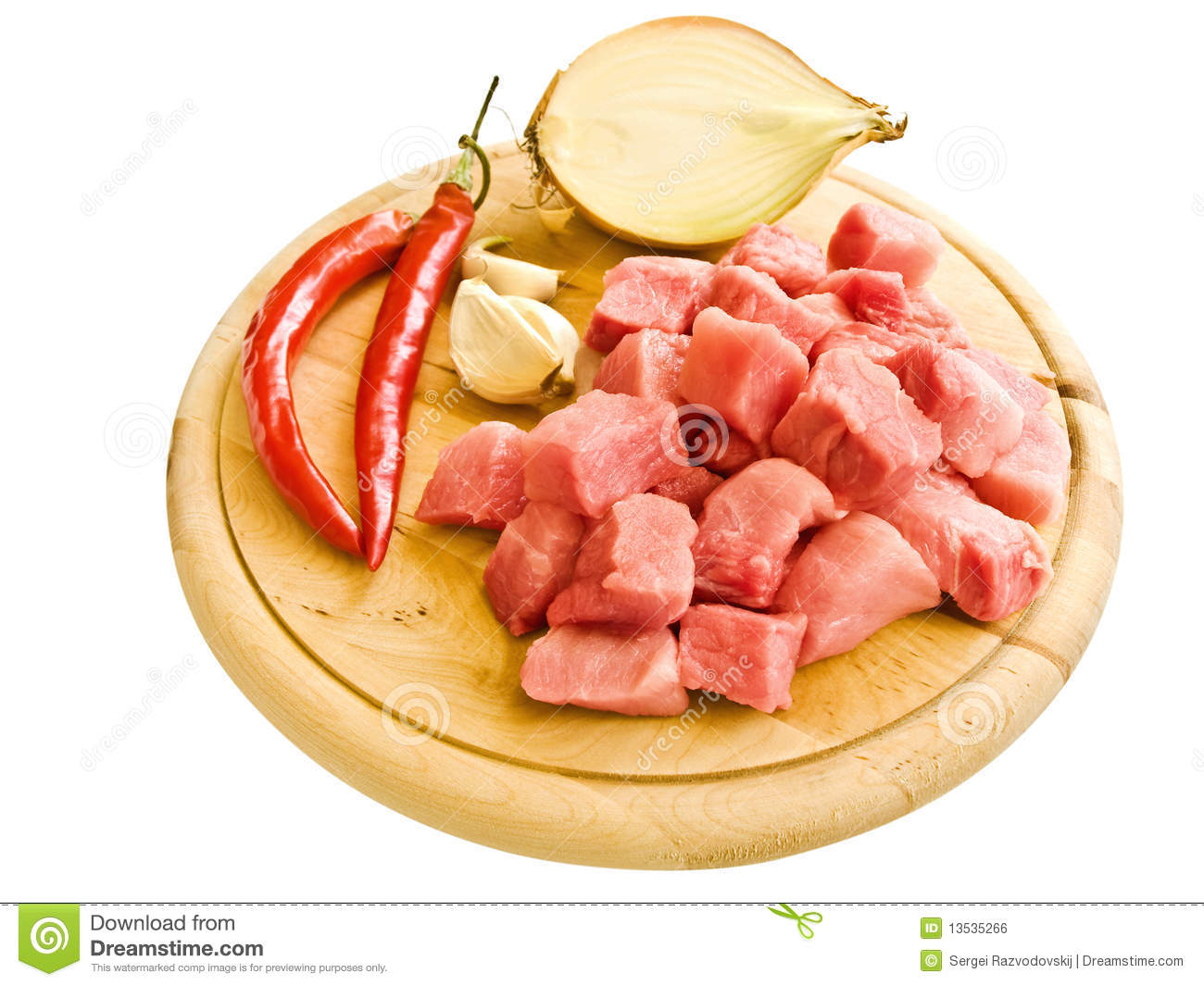 Pieces Of Meat With Peppergarlic And Onion On Hardboard