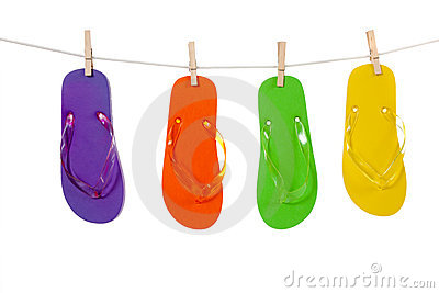 Group Of Colorful Flip Flop Sandles Hanging By Clips From A Clothes