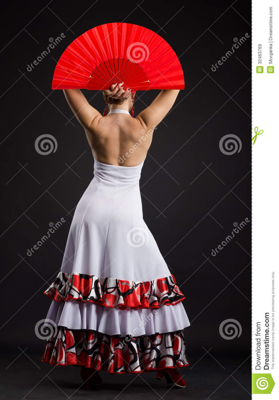 Spanish Woman Dancing Flamenco Against Dark Background Royalty Free    