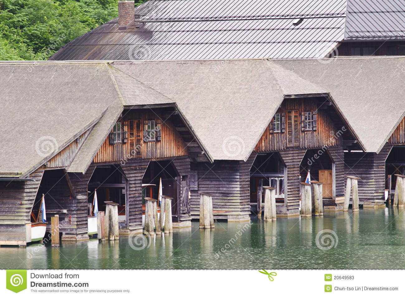 Ancient Wooden Ship Dock Over Clear Green Water In Germanyeurope