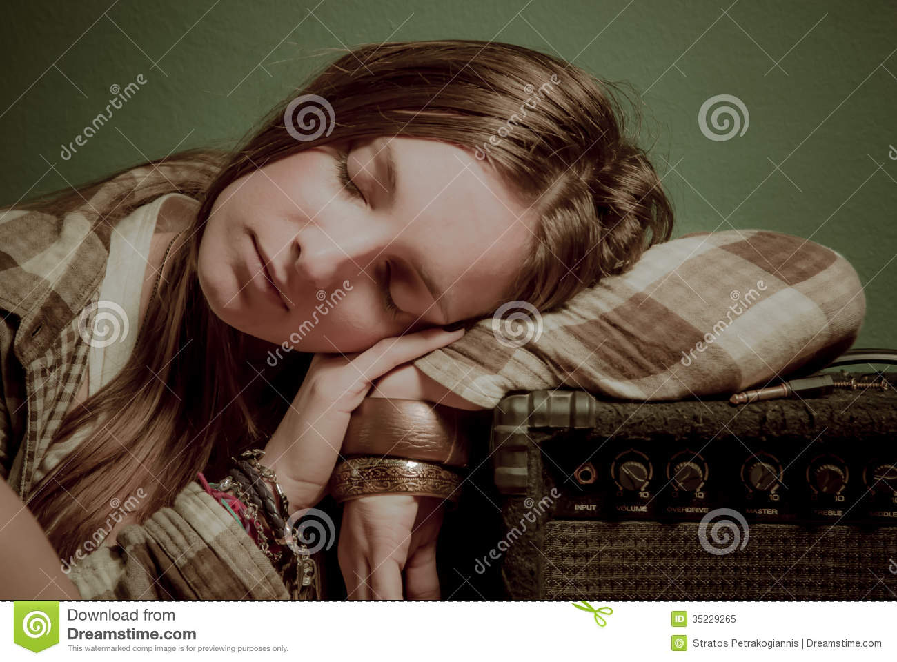 Beautiful Teenage Girl Sleeping On A Sound Device Royalty Free Stock