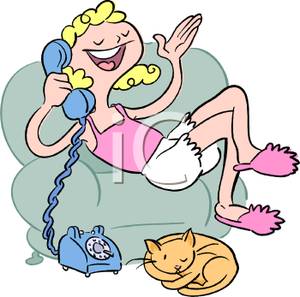 Teenage Girl Sitting On A Sofa Chatting On The Phone With Her Cat At