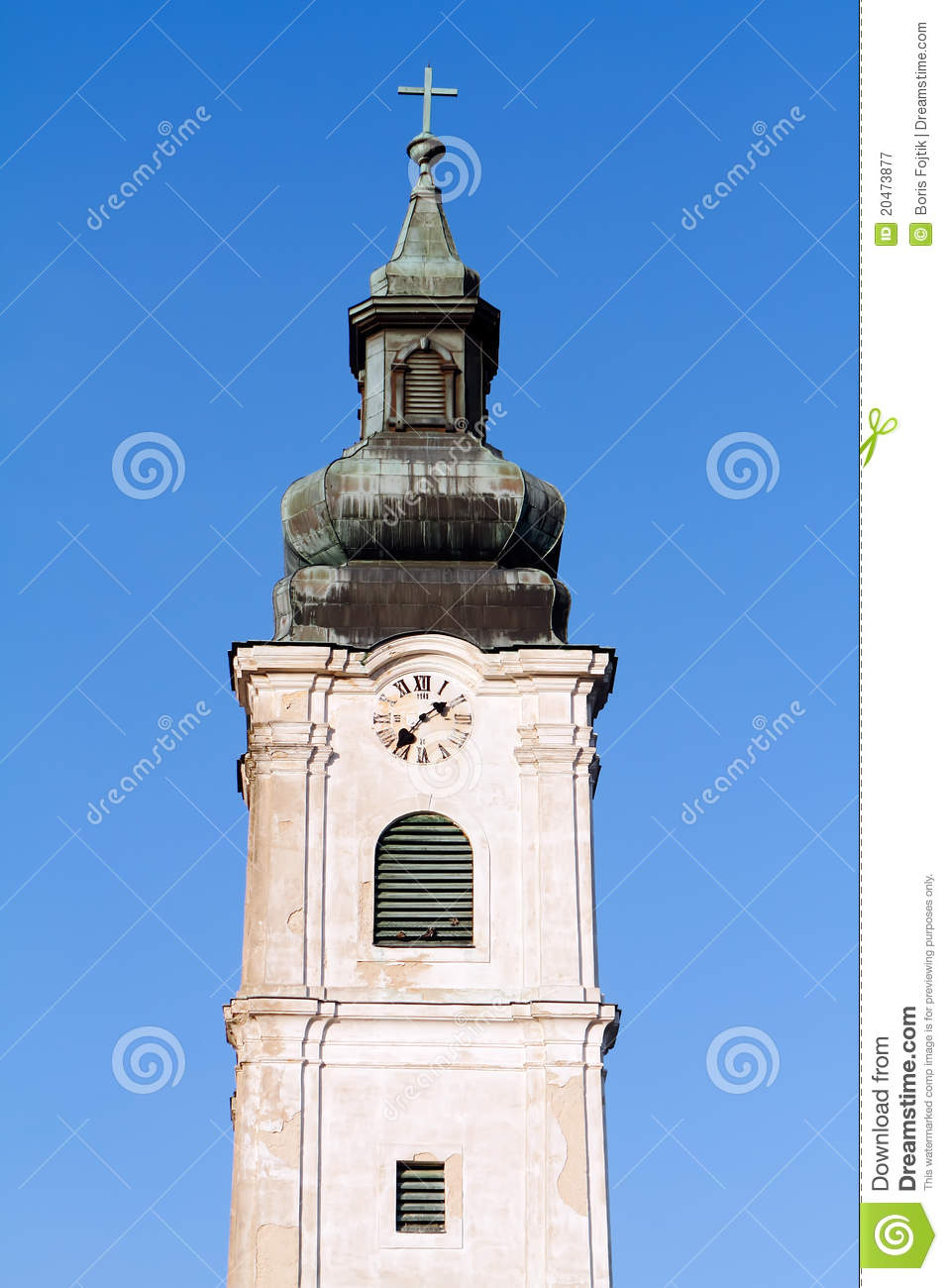 Bell Tower Of A Church Under The Blue Sky In Portrait Orientation
