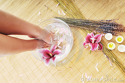 Woman Spa Pedicure Foot Treatment With Water And Flower