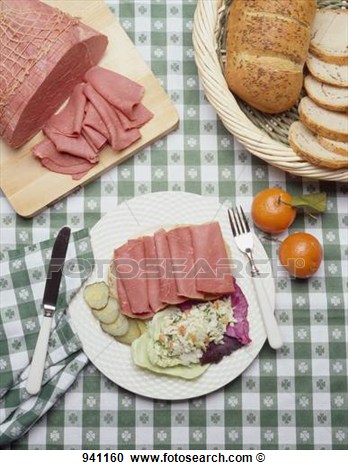 Of Sliced Corned Beef On A Plate With Cole Slaw On Shamrock Tablecloth