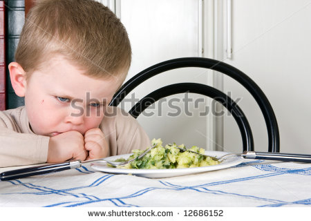 Four Year Old Boy Refusing To Eat His Dinner   Stock Photo