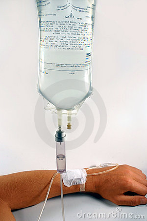 Transparent Drip Bag And Tubing Connected To A Man S Arm Against A    