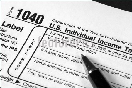 Picture Of Detail View Of An Income Tax Form About To Be Completed