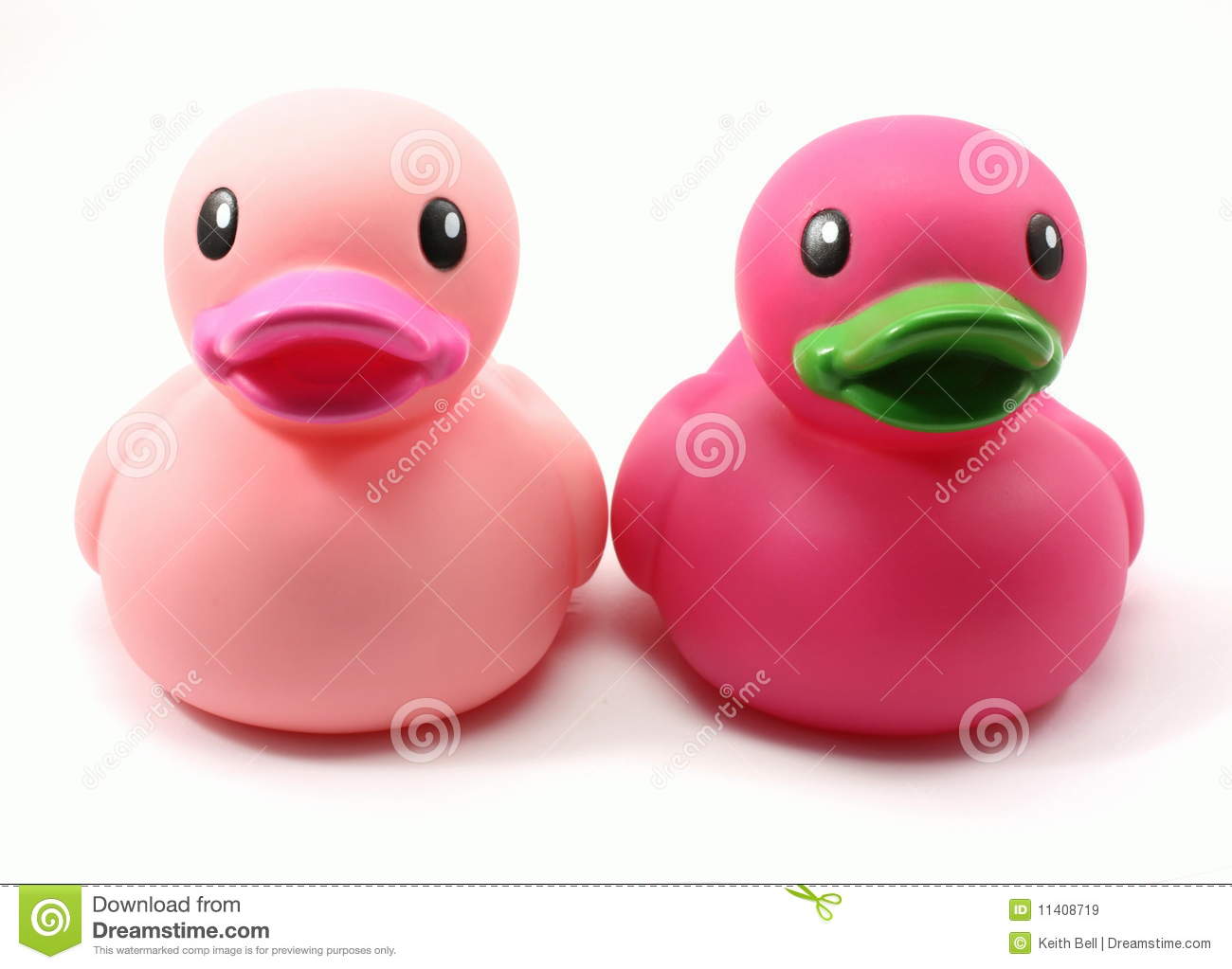 Set Of Two Child S Pink And Purple Rubber Duck Bath Toys Photographed