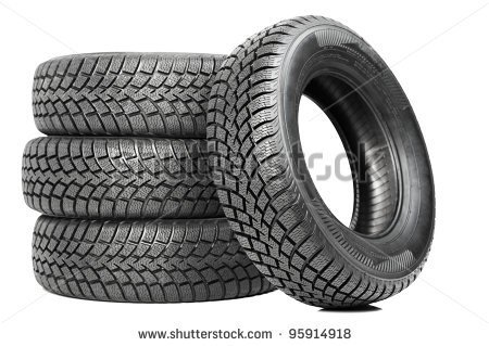 Stack Of Four Wheel New Black Tyres For Winter Car Driving Isolated On    