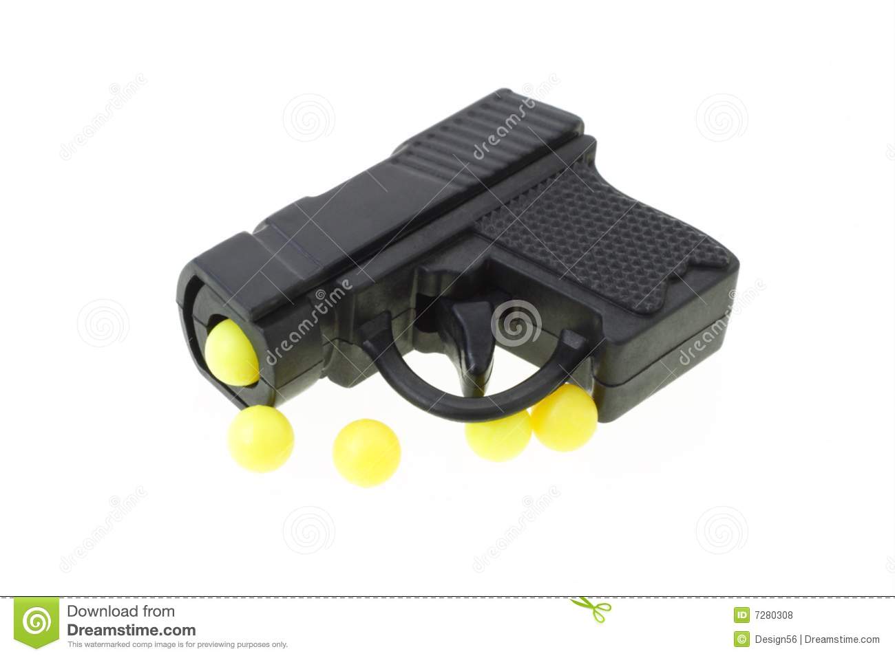 Mini Toy Gun With Yellow Pellets On White Background