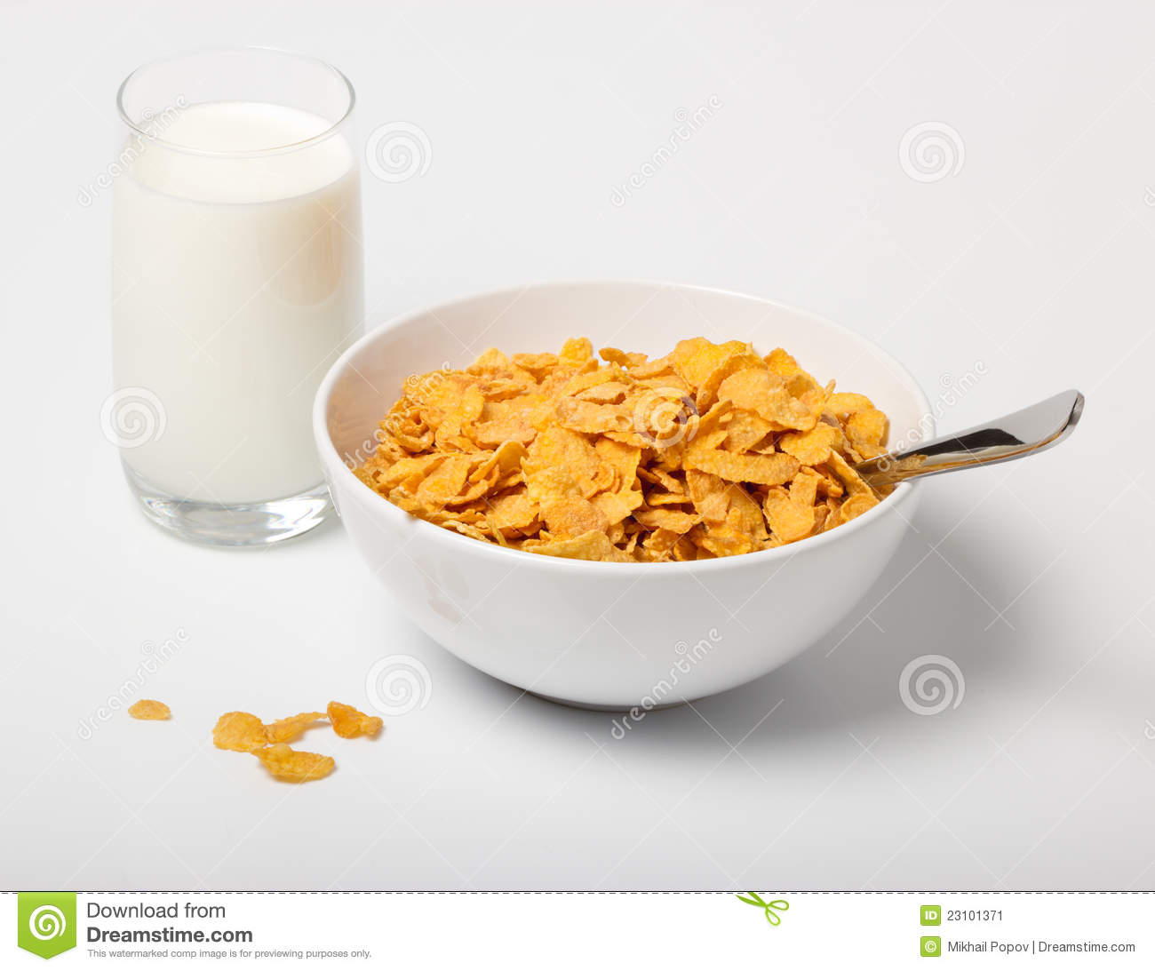 Corn Flakes In Deep Plate With Spoon And Glass With Milk