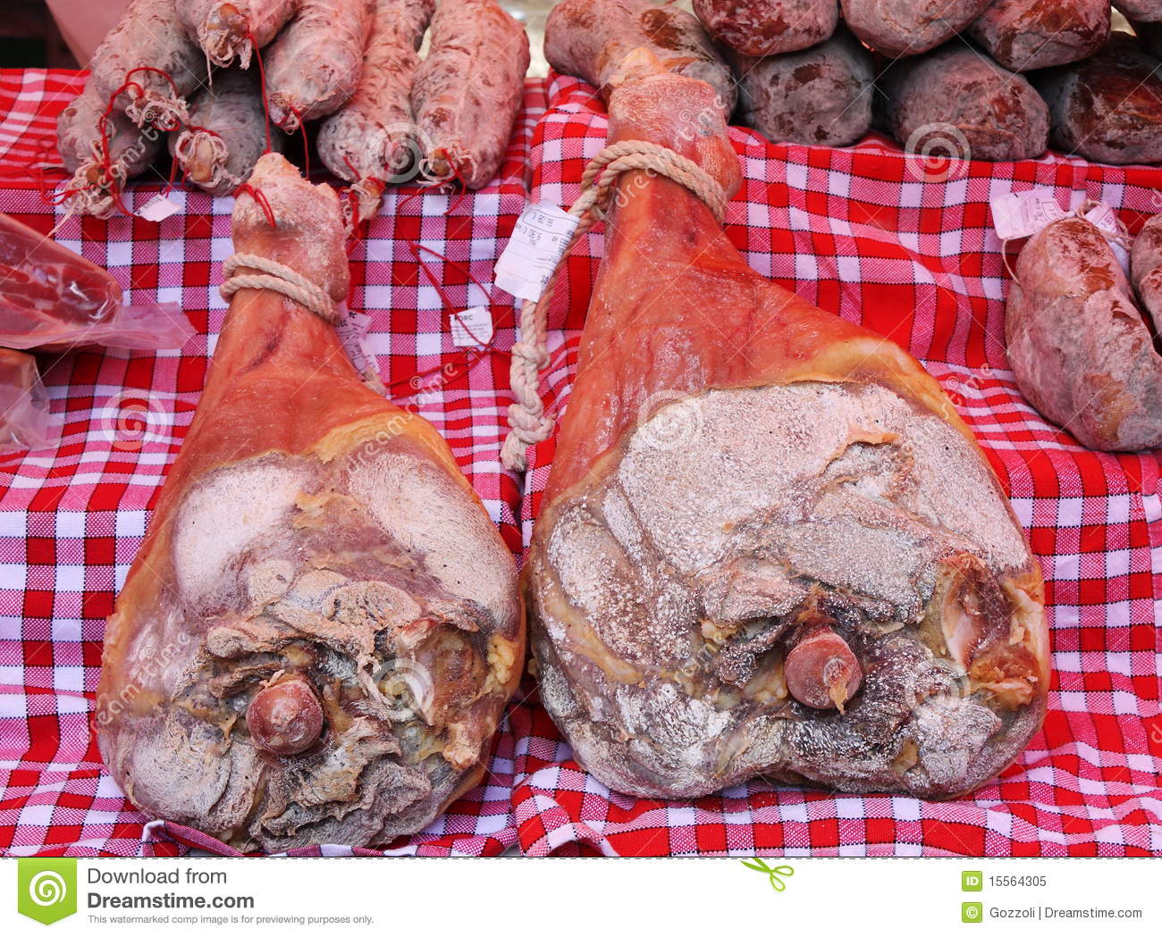 Two Cured And Salted Hams For Sale On An Open Air French Meat Market