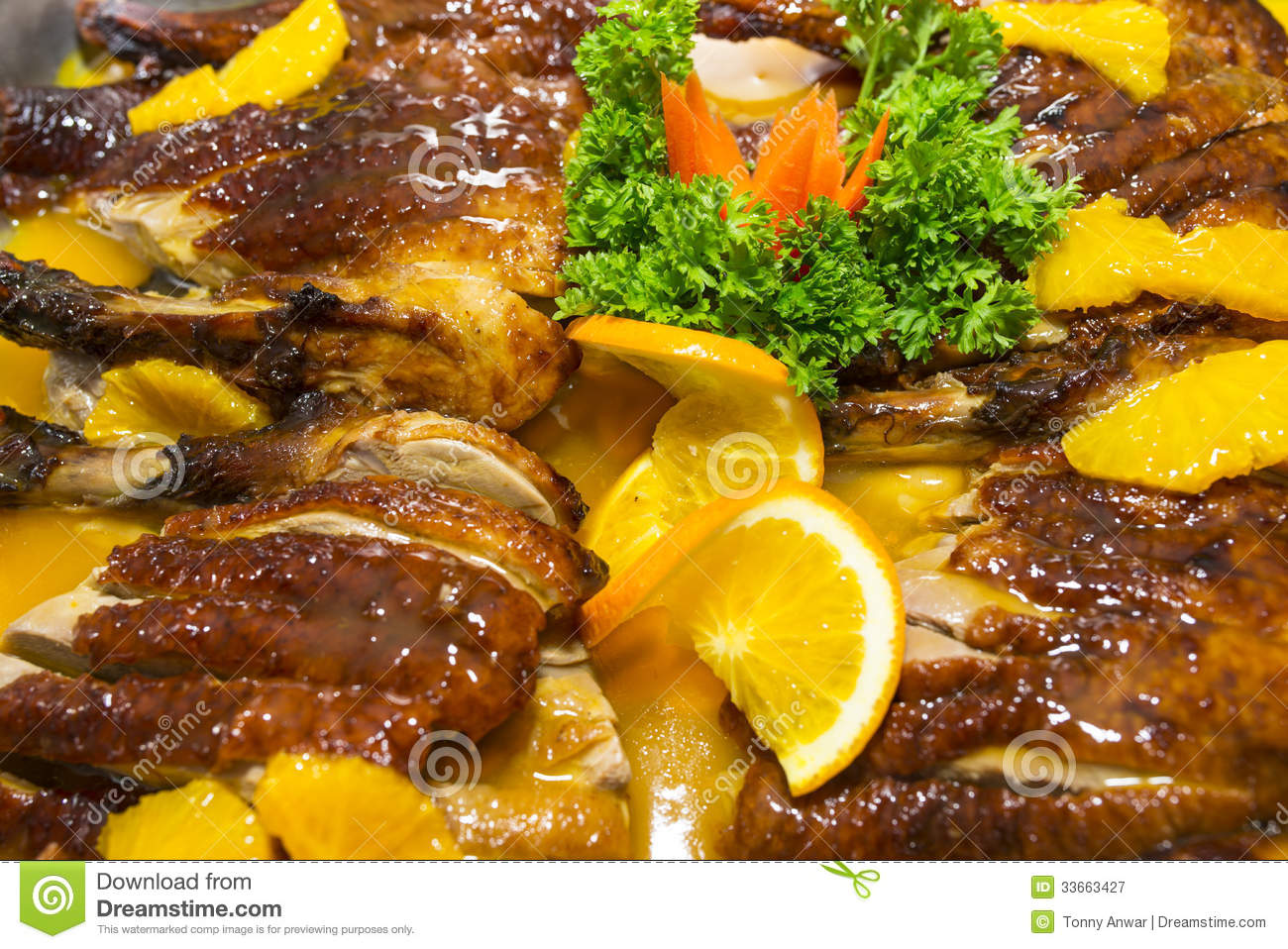 Duck With Orange Sauce And Garnish With Parley And Orange Slice