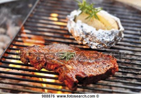 Stock Images Of T Bone Steak And Baked Potato On Barbecue Rack 988876    